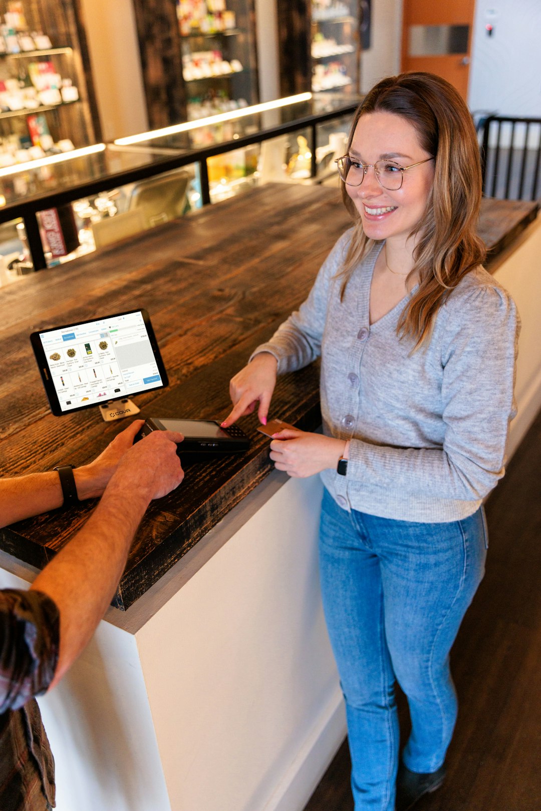 a-man-and-a-woman-standing-at-a-counter-etqk4jbdxr8